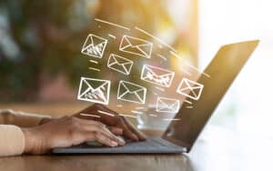 Email Marketing Solutions Coming Out of Laptop